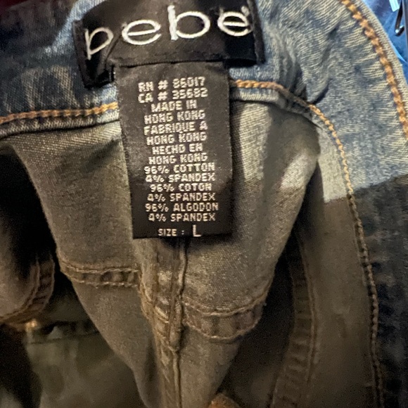 Bebe Flare Jeans with faux suede studded trim lines on the outer leg, Raw hem - Picture 11 of 11